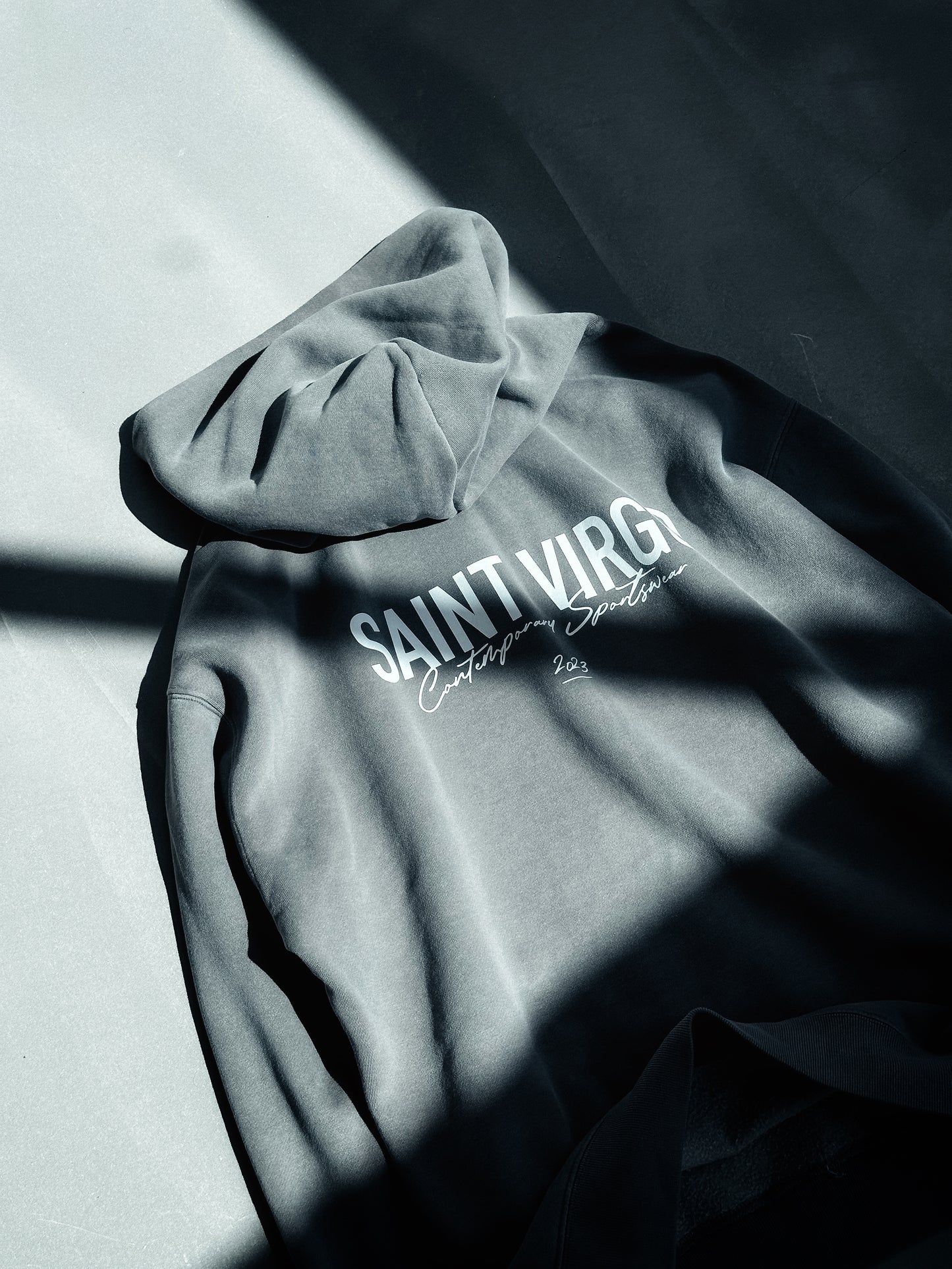 Saint Virgo Athlete Hoodie, designed for the modern athlete, offering contemporary sportswear with a focus on athletic essentialism. This ready-to-wear luxury sportswear piece is perfect for those redefining sportswear with style and performance.