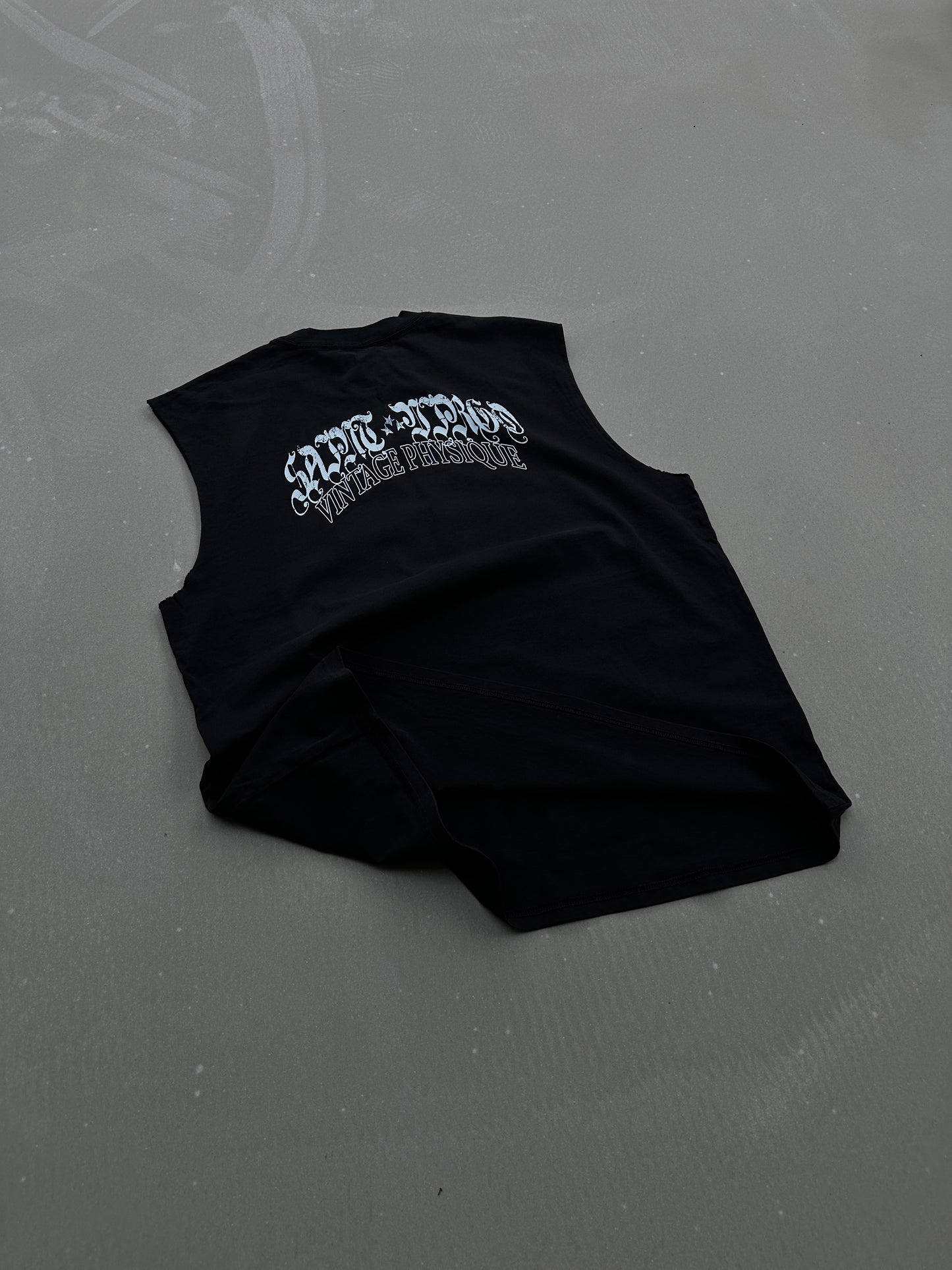 Saint Virgo Vintage Physique Cut Off Tank, blending nostalgic design with modern luxury sportswear. Crafted for those who embrace athletic essentialism, redefining sportswear with a vintage-inspired look for active lifestyles.